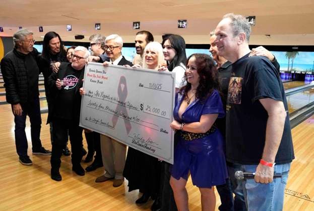 November 13, 2025: Wendy Dio, blonde hair, center presents a check for $25,000 to UCLA for cancer research in the name of her husband, Ronnie James Dio, at the 2025 Bowl for Ronnie celebrity bowling tournament, PINZ Bowling, Studio City, CA, USA, November 13, 2025. The sold-out event which featured many rockers and celebrities, raised funds for the Ronnie James Dio Stand Up and Shout Cancer Fund. The funds are used to support cancer research that focuses on early detection and prevention. Dio passed away from stomach cancer in May 2010 and Bowl For Ronnie started later that year by his wife Wendy Dio. Credit Image cr ZUMA Press - ZUMAmt3_ 20251113_zaf_mt3_017 Copyright: xScottxMitchellx