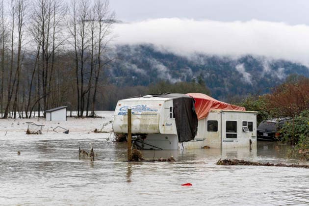 December 11, 2025, Sultana, Washington, USA: Cars and RVs are partially submerged by flood waters from the overflowing Skykomish River on a farm near Sultana, Washington, USA, on Thu., Dec. 11, 2025, after a trio of atmospheric rivers drenched the region. Forecasts said that many rivers in the Pacific Northwest would reach catastrophic flood levels and the governor has declared a state of emergency. Sultana USA - ZUMAb344 20251211_znp_b344_024 Copyright: xM.xScottxBrauerx