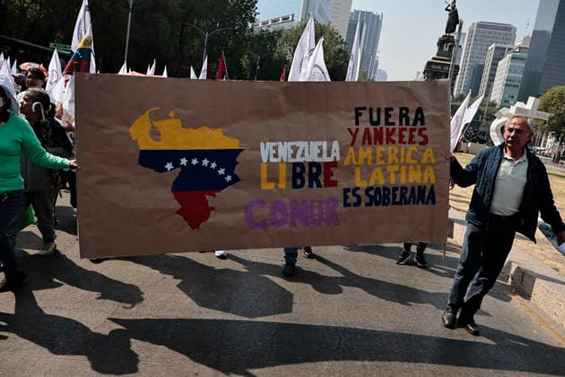 January 10, 2026, Mexico City, Cdmx, Mexico: Mexican protesters and social organizations are demonstrating against the actions of US President DONALD TRUMP against Venezuela and its former president, NICOLAS MADURO. With posters, giant banners, and Venezuelan flags, they are showing their support for MADURO and his vice president, DELCY RODRIGUEZ, who has assumed the presidency due to the country s situation. Chanting slogans like Yankees out of Latin America and Trump, imperialist terrorist, the protesters are demanding the immediate release of NICOLAS MADURO, whom they claim is being held captive by DONALD TRUMP. This comes as protests against these actions spread worldwide, with many believing TRUMP S true objective is to seize V - ZUMAp204 20260110_zip_p204_001 Copyright: xJosuexPerezx
