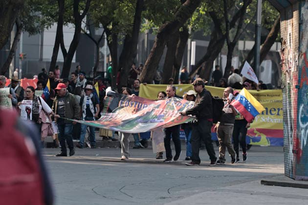 January 10, 2026, Mexico City, Cdmx, Mexico: Mexican protesters and social organizations are demonstrating against the actions of US President DONALD TRUMP against Venezuela and its former president, NICOLAS MADURO. With posters, giant banners, and Venezuelan flags, they are showing their support for MADURO and his vice president, DELCY RODRIGUEZ, who has assumed the presidency due to the country s situation. Chanting slogans like Yankees out of Latin America and Trump, imperialist terrorist, the protesters are demanding the immediate release of NICOLAS MADURO, whom they claim is being held captive by DONALD TRUMP. This comes as protests against these actions spread worldwide, with many believing TRUMP S true objective is to seize V - ZUMAp204 20260110_zip_p204_015 Copyright: xJosuexPerezx