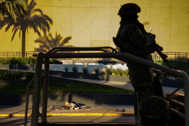Body found with narco-messages in commercial area of Culiacan in Mexico SINALOA, MEXICO - JANUARY 26: (EDITOR S NOTE: Image depicts death) A man is found dead, tortured, and with the skin removed from his face in front of the Cuatro Rios shopping plaza, located in the main commercial area of Culiacan, as the Mexican Army secures the area until investigations are completed, in Sinaloa, Mexico, on January 26, 2026. Three narco-messages written on banners, along with additional mutilated body parts belonging to the victim, are found next to the body. Jesus Verdugo Anadolu Culiacan Mexico. Editorial use only. Please get in touch for any other usage. Copyright: x2026xAnadoluxJesusxVerdugox