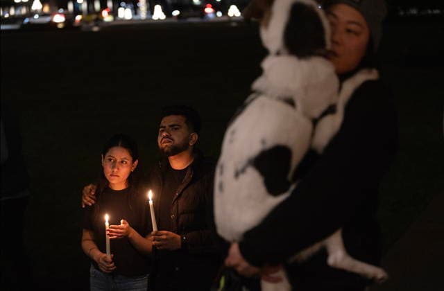 February 11, 2026, Victoria, Bc, CAN: Navjot Kaur, left, joins her partner Arjun Chahal as they attend a candle light vigil at the front steps of the legislature in Victoria, B.C., on Wednesday, Feb. 11, 2026 in honour of the victims of the school shooting in Tumbler Ridge, B.C. Victoria CAN - ZUMAc35_ 20260211_zaf_c35_324 Copyright: xChadxHipolitox