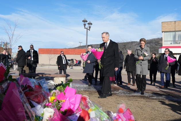 February 13, 2026, Tumbler Ridge, Bc, CANADA: Prime Minister Mark Carney, centre, and his wife Diana Fox Carney arrive with NDP interim Leader Don Davies, left, and Bloc Quebecois Leader Yves-Francois Blanchet, right, to place flowers at a memorial for the victims of a mass shooting, in Tumbler Ridge, B.C., Friday, Feb. 13, 2026. Tumbler Ridge CANADA - ZUMAc35_ 20260213_zaf_c35_117 Copyright: xChristinnexMuschix