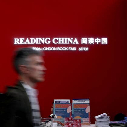 (260311) -- LONDON, March 11, 2026 -- A man walks past the China Pavilion of the 2026 London Book Fair in London, Britain, March 10, 2026. At Olympia London, where the 2026 London Book Fair opened Tuesday, the China pavilion stands out not merely for its expansive footprint, but for the comprehensive publishing ecosystem it showcases. The Chinese publishing delegation has arrived with an impressive portfolio of over 4,000 titles and a packed schedule of more than 40 events. Spanning the three-day fair, the agenda ranges from high-profile new book launches and author talks to rights exchanges and industry forums. TO GO WITH Feature: Two-way street -- China s delegation highlights cultural synergy, tech fusion at London Book Fair ) B