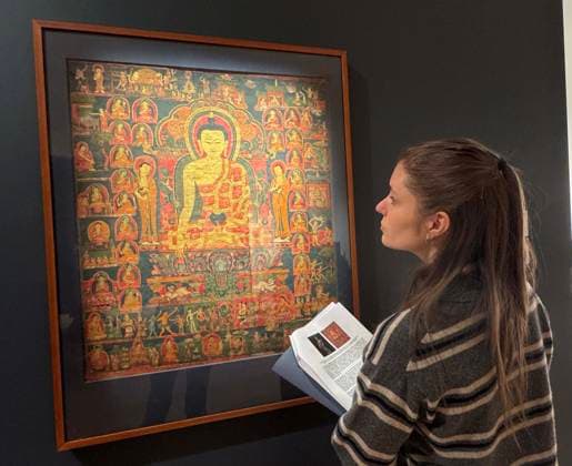 March 19, 2026, New York, New York, USA: A woman views a Thangka depicting the Life of the Budda, Tibet, 14th Century, estimate $220,000 - $400,000, seen on display during the press preview for Sotheby s New York Inaugural Asian Art Sales, the first ever held at the Breuer Building. New York USA - ZUMAk03_ 20260319_zaf_k03_020 Copyright: xNancyxKaszermanx