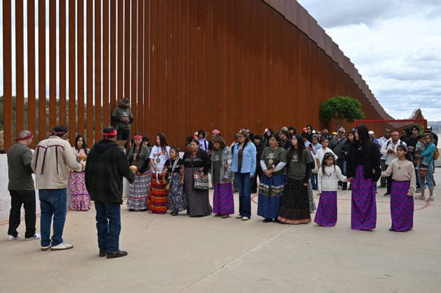 April 12, 2026, Tecate, Baja California, Mexico: Members of native communities, mainly Kumeyaay native group, during a â€oeceremony†rally against the destruction of the Kuchamaa Mountain left by the construction of a new border wall at the US-Mexico Border in Tecate, Baja California, Mexico on Sunday, April 12, 2026. The Kuchamaa Mountain is considered a sacred site by native groups living in both sides of the border. Tecate Mexico - ZUMAm180 20260412_zip_m180_005 Copyright: xCarlosxA.xMorenox