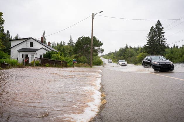 September 5, 2026, Richmond County, Ns, CANADA: Vehicles drive along Old Route 4 in flood water conditions, in Richmond County, Cape Breton, N.S., Saturday, Sept. 5, 2026. Richmond County CANADA - ZUMAc35_ 20260905_zaf_c35_043 Copyright: xStevexWaddenx