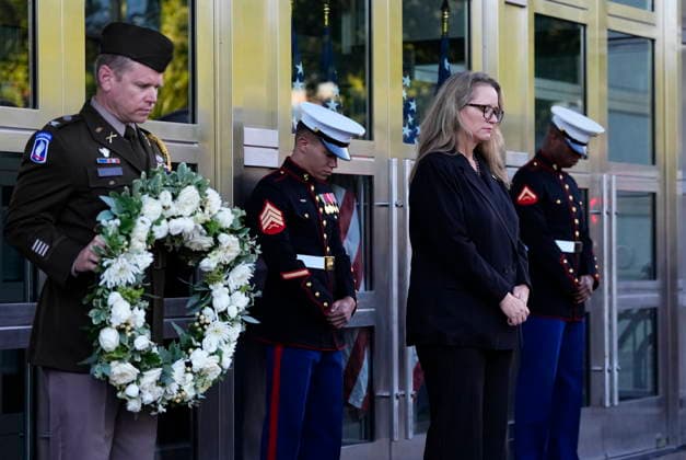 September 11, 2026, Ottawa, On, Canada: Erika Olson, Deputy Chief of Mission, participates in a moment of silence during a commemoration of the 25th anniversary of 9 11, at the U.S. Embassy in Ottawa, on Friday, Sept. 11, 2026. Ottawa Canada - ZUMAc35_ 20260911_zaf_c35_001 Copyright: xJustinxTangx