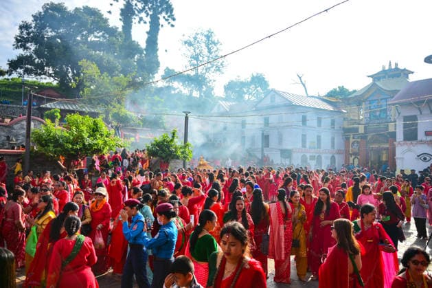 September 14, 2026, Kathmandu, Bagmati, Nepal: Hindu women devotees gather to celebrate the Teej festival at Pashupatinath Temple in Kathmandu, Nepal, on September 14, 2026. Teej, also known as Hartalika Teej, is a major Hindu festival dedicated to Lord Shiva and Goddess Parvati. Women visit the temple from early morning to offer prayers, flowers and puja materials, perform religious rituals and seek blessings. Married women traditionally observe a day-long fast for the health, longevity and well-being of their husbands and the prosperity of their families, while unmarried women may fast and pray for a suitable life partner. Devotees dressed in traditional red saris and festive attire form long queues for darshan and take part in devotional - ZUMAs330 20260914_zsp_s330_016 Copyright: xSafalxPrakashxShresthax