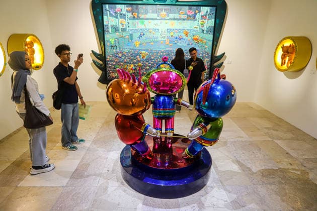 September 20, 2026, Surabaya, East Java, Indonesia: A visitor takes a photo of a contemporary artwork at the ArtSubs 2026 exhibition at Balai Pemuda, Surabaya, East Java, Indonesia, on September 20, 2026. Titled border, threshold, beyond, the art exhibition features 500 works by 113 artists from across Indonesia, serving as a response to the public s need for a space of contemplation, reflection, and entertainment. Surabaya Indonesia - ZUMAp290 20260920_zip_p290_001 Copyright: xRendyxAgungxPrakosox