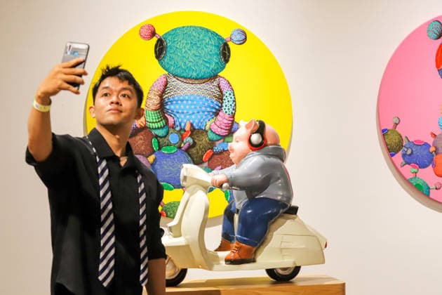 September 20, 2026, Surabaya, East Java, Indonesia: A visitor takes a photo of a contemporary artwork at the ArtSubs 2026 exhibition at Balai Pemuda, Surabaya, East Java, Indonesia, on September 20, 2026. Titled border, threshold, beyond, the art exhibition features 500 works by 113 artists from across Indonesia, serving as a response to the public s need for a space of contemplation, reflection, and entertainment. Surabaya Indonesia - ZUMAp290 20260920_zip_p290_006 Copyright: xRendyxAgungxPrakosox