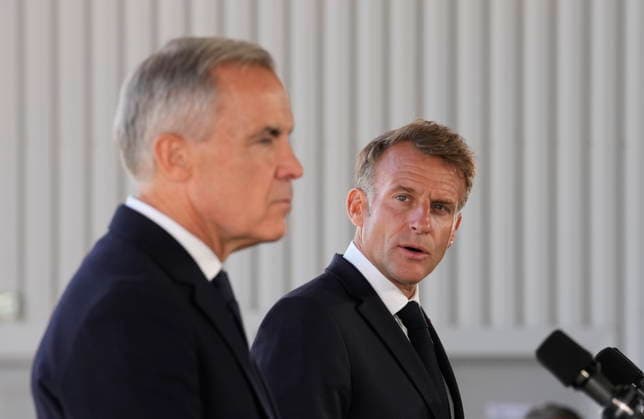 September 20, 2026, Saint-Pierre, France: French President Emmanuel Macron, right, looks to ..Prime Minister Mark Carney as he delivers remarks in Saint-Pierre, Saint-Pierre-et-Miquelon, a French territory 20 kilometres off the southern coast of Newfoundland, on Sunday, Sept.20, 2026. Saint-Pierre France - ZUMAc35_ 20260920_zaf_c35_073 Copyright: xAdrianxWyldx