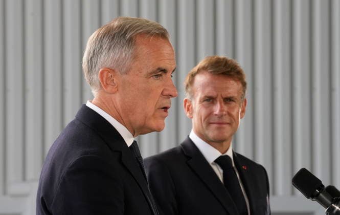 September 20, 2026, Saint-Pierre, France: French President Emmanuel Macron, right, listens to Prime Minister Mark Carney as he delivers remarks in Saint-Pierre, Saint-Pierre-et-Miquelon, a French territory 20 kilometres off the southern coast of Newfoundland, on Sunday, Sept.20, 2026. Saint-Pierre France - ZUMAc35_ 20260920_zaf_c35_078 Copyright: xAdrianxWyldx