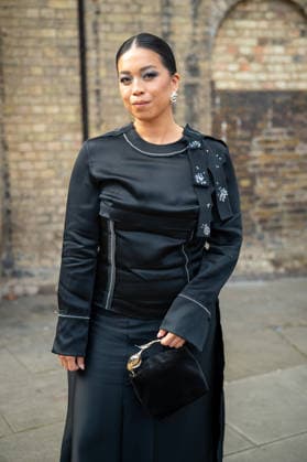 Attendees arrive at the Erderm Catwalk Show London, UK - 20 Sept 2026 An attendee arrives wearing a black dress at the Erdem catwalk show, held at the Roundhouse in Camden, London, as part of London Fashion Week 2026. Models and members of the fashion industry gather at the Roundhouse in Camden, London, for the Erdem catwalk show during London Fashion Week 2026. The event forms part of the official London Fashion Week schedule, bringing together models, designers, fashion professionals, media and guests for the presentation of Erdem s latest collection. London United Kingdom Copyright: xJamesxWilloughbyx xSOPAxImagesx JWILLOUGHBY_3466