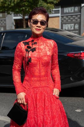 September 20, 2026, London, Camden, United Kingdom: An attendee arrives wearing a red dress and carrying a black handbag at the Erdem catwalk show, held at the Roundhouse in Camden, London, as part of London Fashion Week 2026. Models and members of the fashion industry gather at the Roundhouse in Camden, London, for the Erdem catwalk show during London Fashion Week 2026. The event forms part of the official London Fashion Week schedule, bringing together models, designers, fashion professionals, media and guests for the presentation of Erdem s latest collection. London United Kingdom - ZUMAs197 20260920_aaa_s197_345 Copyright: xJamesxWilloughbyx