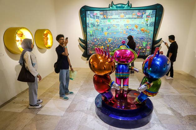 September 20, 2026, Surabaya, East Java, Indonesia: A visitor takes a photo of a contemporary artwork at the ArtSubs 2026 exhibition at Balai Pemuda, Surabaya, East Java, Indonesia, on September 20, 2026. Titled border, threshold, beyond, the art exhibition features 500 works by 113 artists from across Indonesia, serving as a response to the public s need for a space of contemplation, reflection, and entertainment. Surabaya Indonesia - ZUMAp290 20260920_zip_p290_022 Copyright: xRendyxAgungxPrakosox