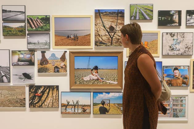 September 20, 2026, Surabaya, East Java, Indonesia: Visitors observe contemporary artworks at the ArtSubs 2026 exhibition at Balai Pemuda, Surabaya, East Java, Indonesia, on September 20, 2026. Titled border, threshold, beyond, the art exhibition features 500 works by 113 artists from across Indonesia, serving as a response to the public s need for a space of contemplation, reflection, and entertainment. Surabaya Indonesia - ZUMAp290 20260920_zip_p290_029 Copyright: xRendyxAgungxPrakosox