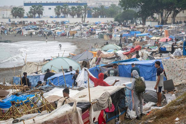 Rain Affects the El Trampolín Beach Settlements in Ceuta. Migrants try to keep their rain-damaged shacks standing on El Trampolín Beach on September 28, 2026, in Ceuta, Spain. Around 3,000 migrants remain in makeshift settlements on Ceuta’s beaches following the massive influx recorded in late July. Continuous rain is flooding the ground and damaging the shacks built with reeds, plastic, cardboard, and sheets on El Trampolín Beach. SEPTEMBER 28, 2026 Ceuta, Ceuta, Spain Copyright: xMarcosxMorenox 7806278
