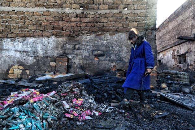 Olha Shylimina, head of the Loving Hearts animal shelter, examines the charred remains of pet food at the shelter’s destroyed main building in the Odesa region, Ukraine, September 29, 2026. During a nighttime Russian drone strike, the roof of the building - covering more than 400 square metres - was hit. The fire destroyed the premises along with stocks of grain, medicines, warm blankets, bowls, and other critical supplies. Thirteen animals - 10 cats and three dogs - died as a result of the strike and ensuing fire. (Photo by Nina Liashonok Ukrinform) Russia strikes animal shelter near Odesa Copyright: xNinaxLiashonokx