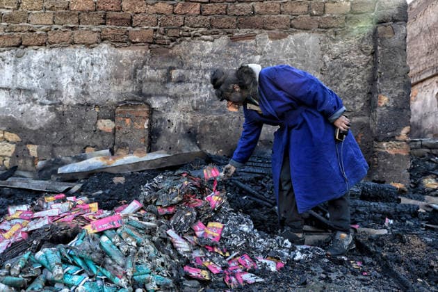 Olha Shylimina, head of the Loving Hearts animal shelter, examines the charred remains of pet food at the shelter’s destroyed main building in the Odesa region, Ukraine, September 29, 2026. During a nighttime Russian drone strike, the roof of the building - covering more than 400 square metres - was hit. The fire destroyed the premises along with stocks of grain, medicines, warm blankets, bowls, and other critical supplies. Thirteen animals - 10 cats and three dogs - died as a result of the strike and ensuing fire. (Photo by Nina Liashonok Ukrinform) Russia strikes animal shelter near Odesa Copyright: xNinaxLiashonokx