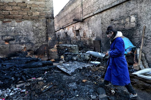 Olha Shylimina, head of the Loving Hearts animal shelter, examines the charred remains of pet food at the shelter’s destroyed main building in the Odesa region, Ukraine, September 29, 2026. During a nighttime Russian drone strike, the roof of the building - covering more than 400 square metres - was hit. The fire destroyed the premises along with stocks of grain, medicines, warm blankets, bowls, and other critical supplies. Thirteen animals - 10 cats and three dogs - died as a result of the strike and ensuing fire. (Photo by Nina Liashonok Ukrinform) Russia strikes animal shelter near Odesa Copyright: xNinaxLiashonokx