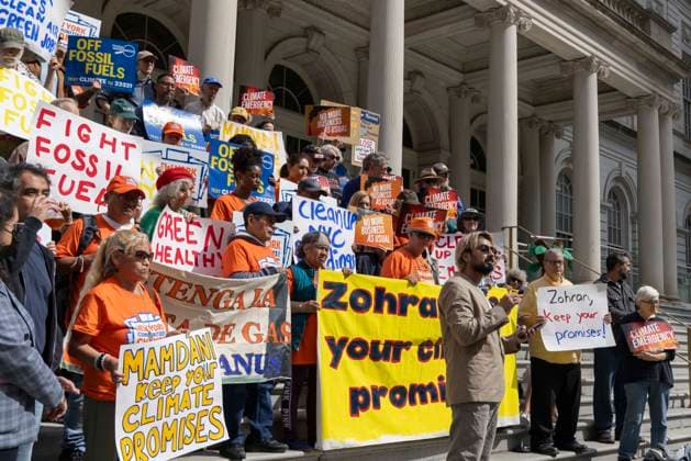 September 30, 2026, New York, New York, USA: Environmental advocates rally on the City Hall steps calling for Mayor Mamdani to keep his campaign promises to decarbonize New York City. Participants hold signs that read OFF FOSSIL FUELS Zohran keep your promises! MAMDANI KEEP YOUR CLIMATE PROMISES CLIMATE EMERGENCY. Organizers call for the mayor to close the loophole in NYCâ€⠢s primary climate law, Local Law 97, to invest in green healthy public schools, fight fossil fuel infrastructure and fracked gas power plants. Participating organizations are Food & Water Watch, ALIGN, TREEage, NYPIRG, Rise & Resist, New York Communities for Change, Sunrise Movement NYC, Climate Defenders, Climate Defiance and Hot Girls Organize. New York U - ZUMAr174 20260930_znp_r174_039 Copyright: xGinaxMxRandazzox