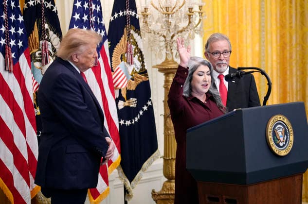 September 30, 2026, Washington, District Of Columbia, USA: United States President Donald J Trump listens to a blessing from Pastors Norma Urrabazo, center, and Pasqual Urrabazo, right, from Nevada during a Hispanic Heritage Month celebration event in the East Room of the White House in Washington, DC, USA, Wednesday, September 30, 2026 Washington USA - ZUMAs152 20260930_faa_s152_097 Copyright: xYurixGripasx-xPoolxviaxCNPx
