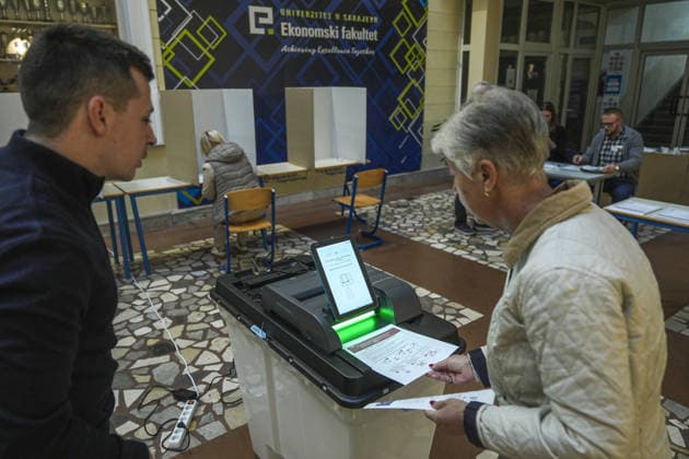 Voters cast ballots in Sarajevo as Bosnia and Herzegovina holds general elections SARAJEVO, BOSNIA AND HERZEGOVINA - OCTOBER 04: Voters cast their ballots as polling stations open for the 2026 General Elections in Sarajevo, Bosnia and Herzegovina on October 04, 2026. The nationwide vote features the inaugural use of new electoral technologies, including biometric voter identification, optical ballot scanners, and automated result transmission systems. Citizens are voting to elect members of the tripartite Presidency of Bosnia and Herzegovina, deputies to the Parliamentary Assembly, the Federation of BiH Parliament, the President and Vice Presidents of Republika Srpska, the National Assembly of Republika Srpska, and cantonal assemblies. Sami Copyright: x2026xAnadoluxSamirxJordamovicx