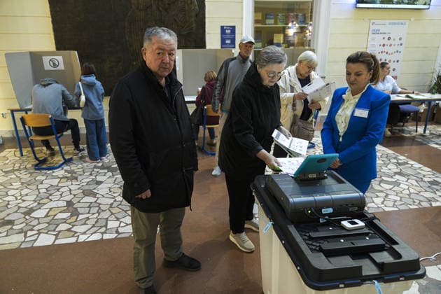 Voters cast ballots in Sarajevo as Bosnia and Herzegovina holds general elections SARAJEVO, BOSNIA AND HERZEGOVINA - OCTOBER 04: Voters cast their ballots as polling stations open for the 2026 General Elections in Sarajevo, Bosnia and Herzegovina on October 04, 2026. The nationwide vote features the inaugural use of new electoral technologies, including biometric voter identification, optical ballot scanners, and automated result transmission systems. Citizens are voting to elect members of the tripartite Presidency of Bosnia and Herzegovina, deputies to the Parliamentary Assembly, the Federation of BiH Parliament, the President and Vice Presidents of Republika Srpska, the National Assembly of Republika Srpska, and cantonal assemblies. Sami Copyright: x2026xAnadoluxSamirxJordamovicx
