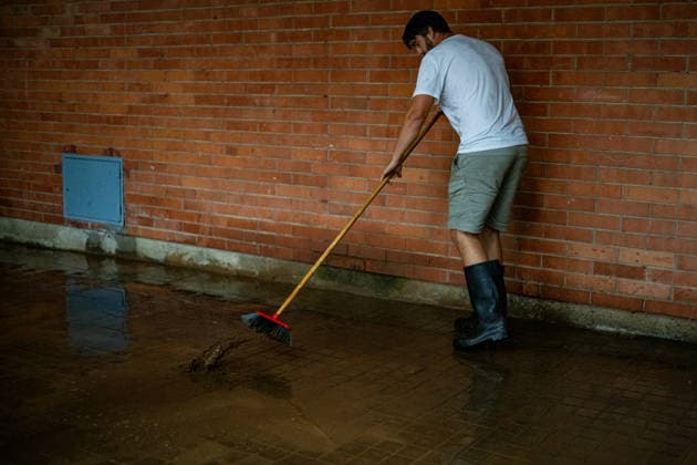 Heavy rains in Catalonia cause widespread disruption. A person cleans up a flooded street in the Nou Barris neighborhood on October 5, 2026, in Barcelona, Catalonia, Spain. Rain and storms will once again dominate the day on Monday, though with less intensity than over the weekend, with yellow and orange alerts in effect at times in some areas of the country, and even a red alert remaining in effect until 10 a.m. in Barcelona, with cumulative rainfall of 90 l m². OCTOBER 5, 2026 Lorena Sopê Barcelona, Catalonia, Spain Copyright: xLorenaxSopênax 7822403