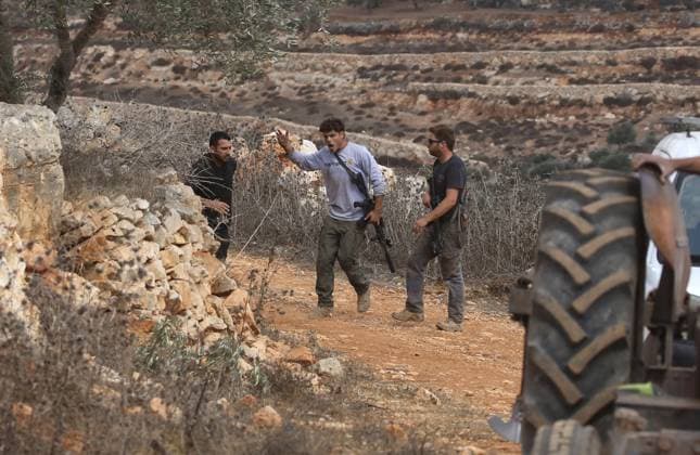 October 6, 2026, Aqraba, Palestine, State of: AQRABA, OCCUPIED WEST BANK, OCTOBER 6, 2026: Palestinian farmers come under attack by Israeli settlers while harvesting olives in the village of Aqraba, south of Nablus. Several Palestinians were wounded after settlers opened fire and assaulted farmers during the harvest, according to Palestinian reports. Israeli forces later detained a Palestinian farmer at the scene, according to information provided by the photographer. The Israeli military had not immediately commented on the reported shooting. Aqraba Palestine, State of - ZUMAq101 20261006_zna_q101_068 Copyright: xNedalxShtiehx