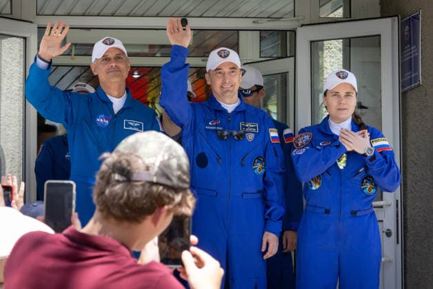 October 8, 2026, Baikonur, Kazakhstan: Baikonur, Kazakhstan. 14 July, 2026. NASA astronaut Anil Menon, left, and Roscosmos cosmonauts Pyotr Dubrov and Anna Kikina wave as they depart the Cosmonaut Hotel for suit-up, July 14, 2026 in Baikonur, Kazakhstan. The crew launched later that day to the International Space Station. Baikonur Kazakhstan - ZUMAp138 20261008_zaa_p138_004 Copyright: xVictorxZelentsov Nasax