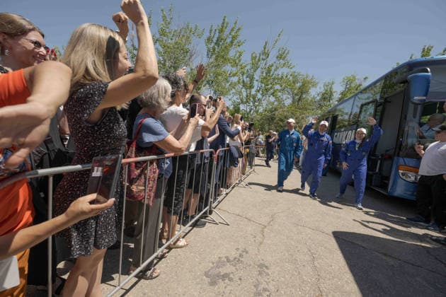 October 8, 2026, Baikonur, Kazakhstan: Baikonur, Kazakhstan. 14 July, 2026. NASA astronaut Anil Menon, left, and Roscosmos cosmonauts Pyotr Dubrov and Anna Kikina walk out of the Cosmonaut Hotel to suit up for their Soyuz launch, July 14, 2026 in Baikonur, Kazakhstan. The crew launched later that day to the International Space Station. Baikonur Kazakhstan - ZUMAp138 20261008_zaa_p138_026 Copyright: xBillxIngalls Nasax