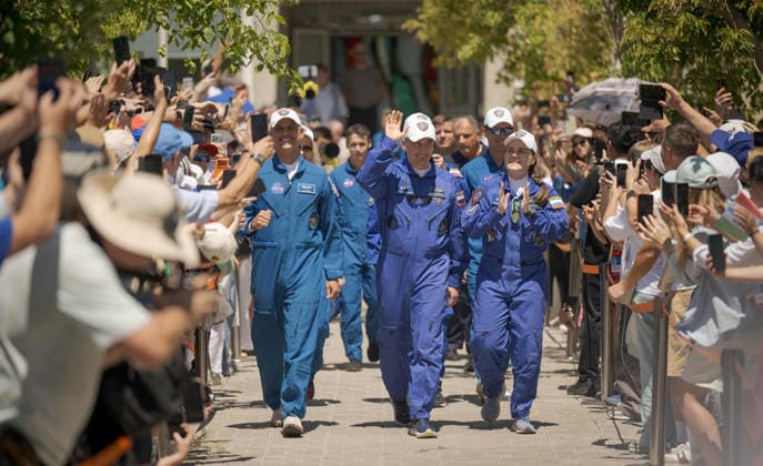October 8, 2026, Baikonur, Kazakhstan: Baikonur, Kazakhstan. 14 July, 2026. NASA astronaut Anil Menon, left, and Roscosmos cosmonauts Pyotr Dubrov and Anna Kikina walk out of the Cosmonaut Hotel to suit up for their Soyuz launch, July 14, 2026 in Baikonur, Kazakhstan. The crew launched later that day to the International Space Station. Baikonur Kazakhstan - ZUMAp138 20261008_zaa_p138_023 Copyright: xBillxIngalls Nasax