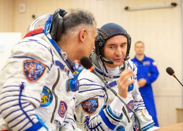 October 8, 2026, Baikonur, Kazakhstan: Baikonur, Kazakhstan. 14 July, 2026. NASA astronaut Anil Menon, left, and Roscosmos cosmonaut Pyotr Dubrov talk to family and friends after Sokol suit pressure checks at the Baikonur Cosmodrome, July 14, 2026 in Baikonur, Kazakhstan. The crew launched to the International Space Station later that day. Baikonur Kazakhstan - ZUMAp138 20261008_zaa_p138_038 Copyright: xPavelxShvets Gctcx