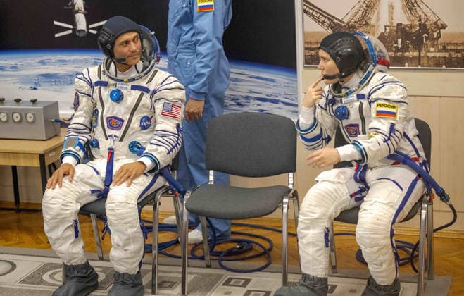 October 8, 2026, Baikonur, Kazakhstan: Baikonur, Kazakhstan. 14 July, 2026. NASA astronaut Anil Menon, left, and Roscosmos cosmonaut Anna Kikina wait for Sokol suit pressure checks at the Baikonur Cosmodrome, July 14, 2026 in Baikonur, Kazakhstan. They launched to the International Space Station later that day. Baikonur Kazakhstan - ZUMAp138 20261008_zaa_p138_058 Copyright: xBillxIngalls Nasax