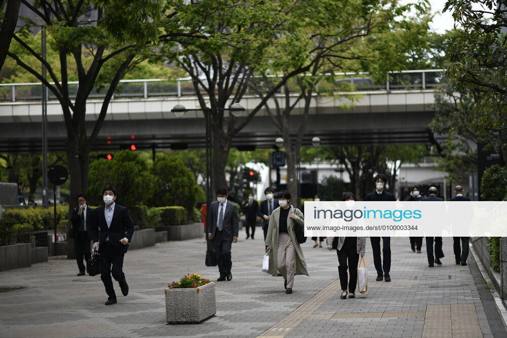 Commuters wearing face mask head to work early morning during a rush hour in Tokyo amid concerns of the COVID-19 coronavirus on Monday, April 27, 2020. Japanese Prime Minister Shinzo Abe declared a nationwide State of Emergency last week urging people to stay home to prevent the spreading of the coronavirus throughout the country. (Photo: Richard Atrero de Guzman AFLO) (125743338)