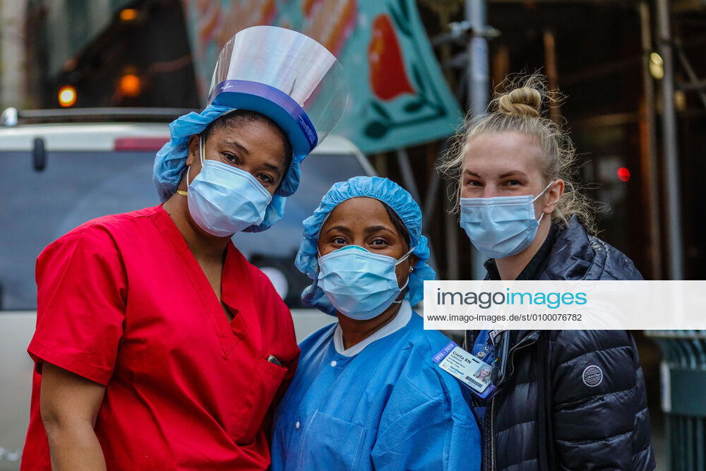 Health professionals are honored by residents and firefighters outside a Manhattan hospital in New York City on Monday during the Coronavirus COVID-19 pandemic in the United States. New York USA - ZUMAc233 20200427_zsp_c233_056