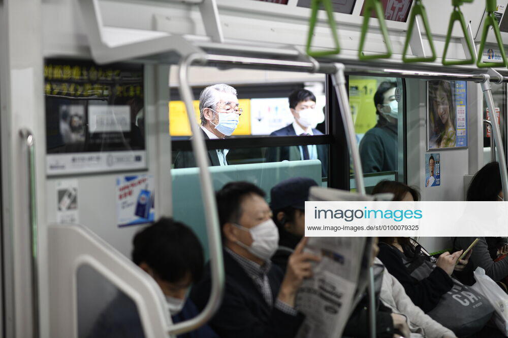 Commuters wearing face mask head to work during a rush hour in Tokyo amid concerns of the COVID-19 coronavirus outbreak on Tuesday, April 28, 2020. Japanese Prime Minister Shinzo Abe declared a nationwide State of Emergency last week urging people to stay home to prevent the spread of the coronavirus throughout the country. (Photo: Richard Atrero de Guzman AFLO) (125774079)