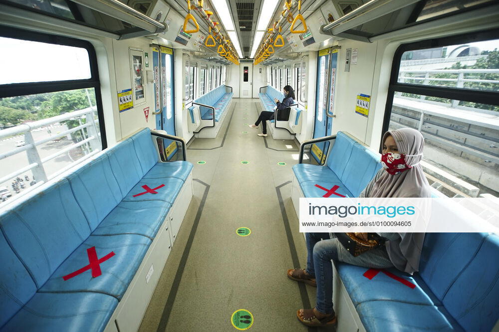 April 28, 2020 : Palembang,South Sumatra, Indonesia : People sit on designated areas decided by red cross marks to ensure social distancing inside a light rapid transit train in Palembang, South Sumatra on April 28, 2020.The Indonesian government has closed mall , tourists destinations and urged citizens to avoid public gatherings, including religious activities as a precautionary measure against the spread of coronavirus. Zuma Wire Palembang Indonesia - ZUMAz115 20200428_zip_z115_007