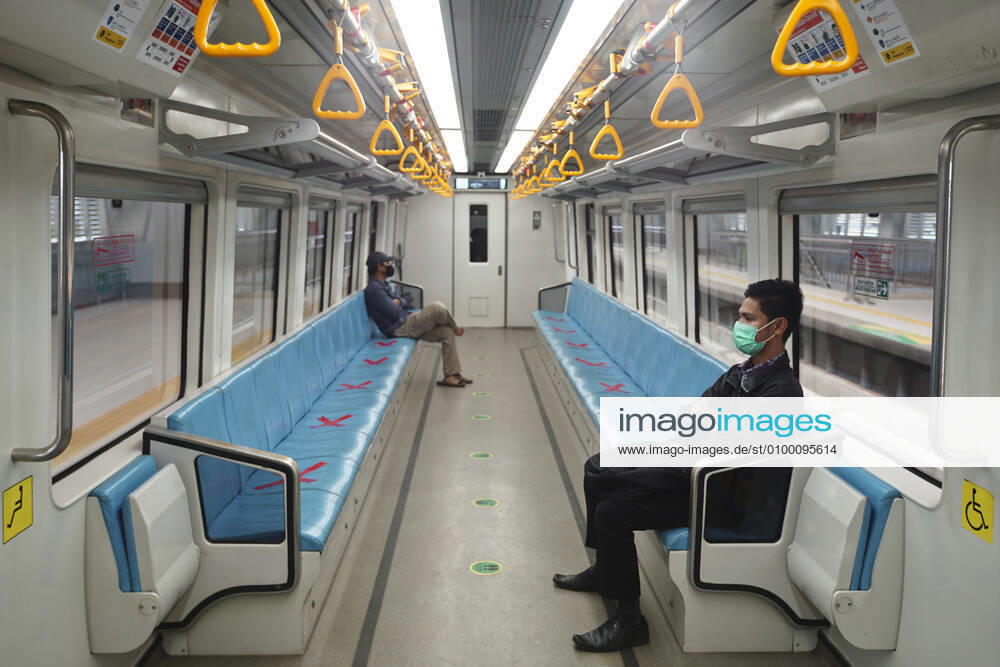April 28, 2020 : Palembang,South Sumatra, Indonesia : People sit on designated areas decided by red cross marks to ensure social distancing inside a light rapid transit train in Palembang, South Sumatra on April 28, 2020.The Indonesian government has closed mall , tourists destinations and urged citizens to avoid public gatherings, including religious activities as a precautionary measure against the spread of coronavirus. Zuma Wire Palembang Indonesia - ZUMAz115 20200428_zip_z115_013