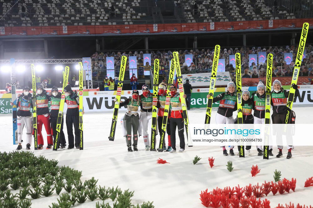 NORDIC SKIING - FIS Nordic World Ski Championships Oberstdorf 2021 OBERSTDORF,GERMANY,26.FEB.21 - NORDIC SKIING, Ski jumping, Skispringen, Ski, nordisch - FIS Nordic World Ski Championships, normal hill, team event, ladies, flower ceremony. Image shows the rejoicing of Team NOR, Team AUT and Team SLO. +013021000191 1+