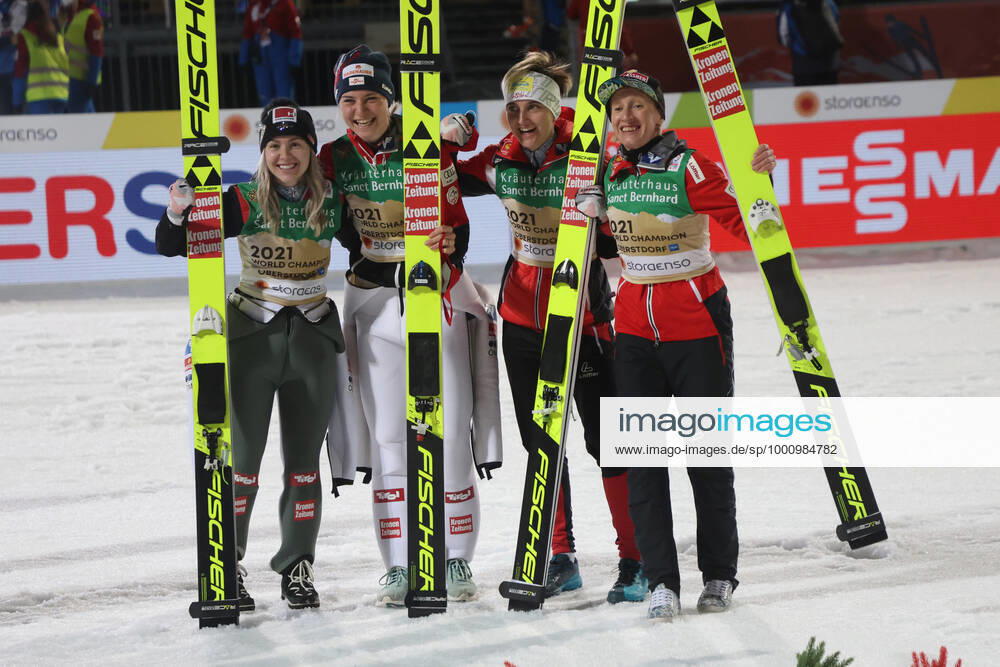 NORDIC SKIING - FIS Nordic World Ski Championships Oberstdorf 2021 OBERSTDORF,GERMANY,26.FEB.21 - NORDIC SKIING, Ski jumping, Skispringen, Ski, nordisch - FIS Nordic World Ski Championships, normal hill, team event, ladies, flower ceremony. Image shows Marita Kramer, Chiara Hoelzl, Sophie Sorschag and Daniela Iraschko-Stolz (AUT). +013021000191 1+