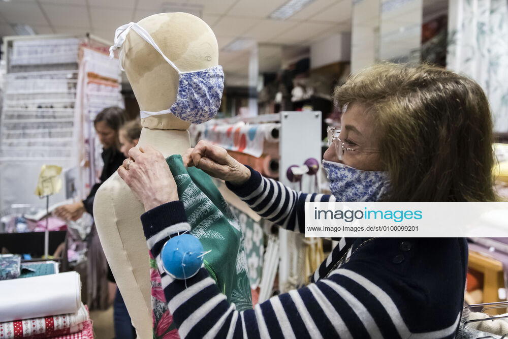 Chambery, France April 28, 2020 - Atmosphere during the reopening of the fabric store Charrire Paul Ets in the center of Chambery. Fabric stores are allowed to reopen to allow every French person who wants to get the raw materials they need to make masks, the government announced on Friday ECONOMIE, REOUVERTURE, REPRISE ECONOMIQUE, TISSU, FABRICATION DE MASQUES, CONFINEMENT, LEGISLATION, COVID19, PANDEMIE, CORONAVIRUS, SAVOIE, PME, ENTREPRISE FAMILIALE, MAGASIN DE TISSU, MERCERIE, TEXTILE, VENTE AU DETAIL, BOUTIQUE, VENDEUSE, FABRIQUER SON MASQUE EN TISSU, DECRET, COMMERCANTS, EMPLOI, TRAVAIL, CRISE ECONOMIQUE, MATIERES PREMIERES, TISSUS, COUTURE, COUDRE, FAIT MAISON, TISSUS CHARRIERE