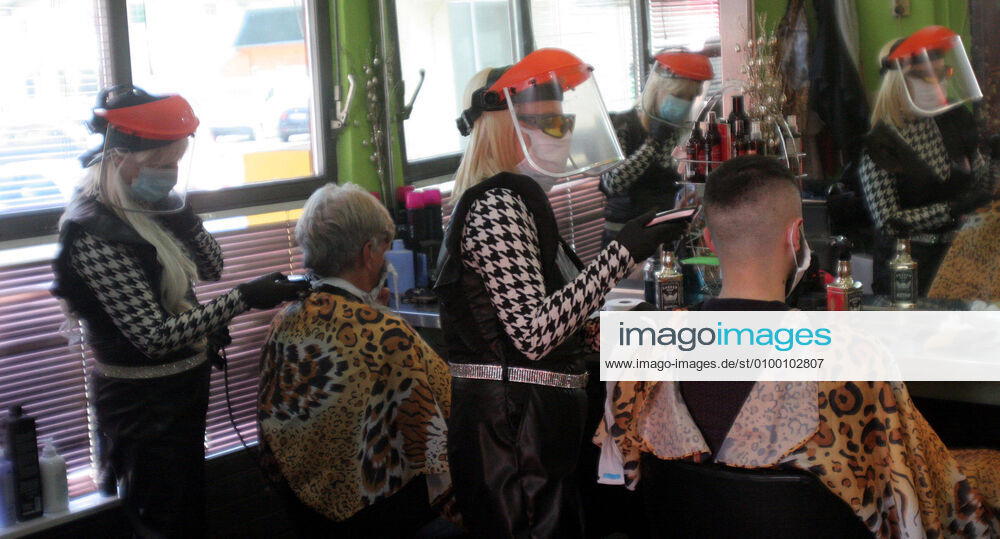 Belgrade(Serbia) Coronavirus Covid-19 Life loosening measures Friseur hair stylist studio Goca Gotza open after 43 days state of emergency.Friseours Hairdressers Gordana and Sladjana working with new protection masks and vizir visor made of plexiglass.