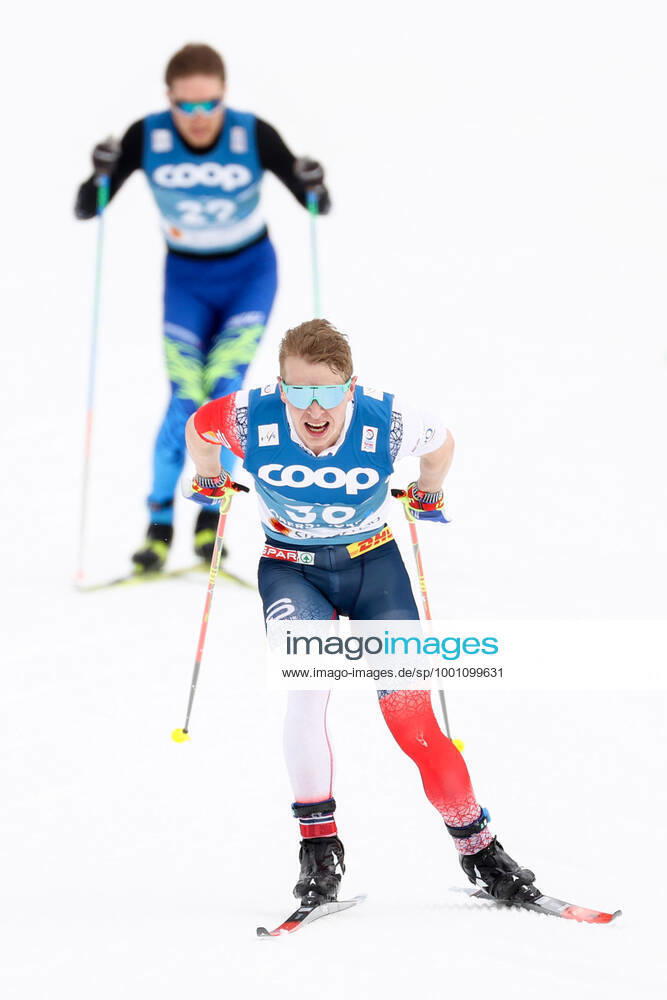 NORDIC SKIING - FIS Nordic World Ski Championships Oberstdorf 2021 OBERSTDORF,GERMANY,03.MAR.21 - NORDIC SKIING, CROSS COUNTRY SKIING - FIS Nordic World Ski Championships, 15km free, men. Image shows Simen Hegstad Krueger (NOR) and Olzhas Klimin (KAZ). GEPAxpictures xChristianxWalgram