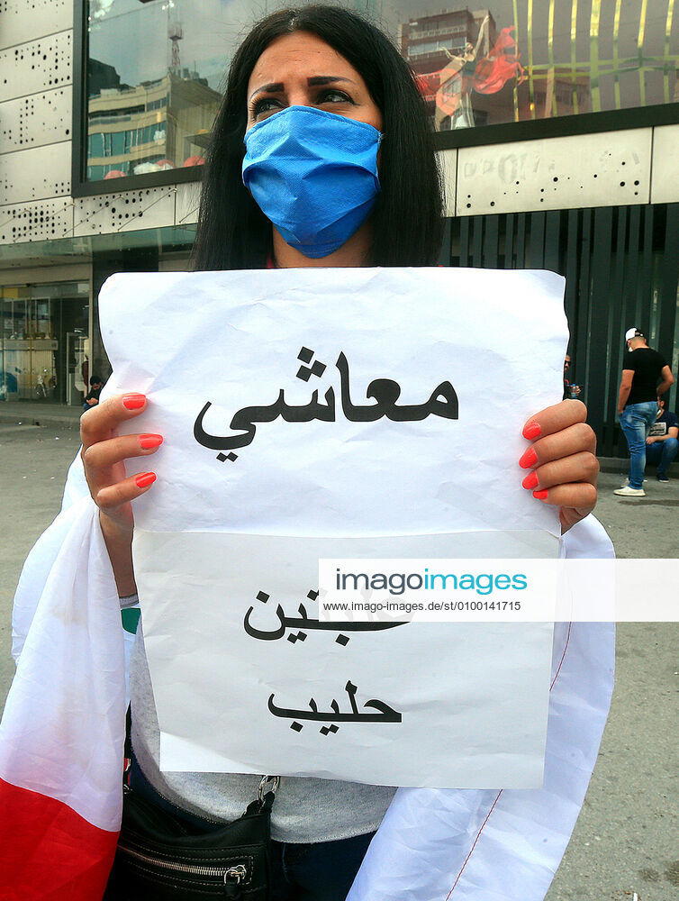 Lebanese protester Anti-government holds a Banner during a protest against growing economic hardship in Beirut, Lebanon April 28, 2020. Hundreds of protesters in Lebanon s northern city of Tripoli set fire to two banks and hurled stones at soldiers, who responded with tear gas and batons in renewed clashes triggered by an economic crisis spiraling out of control amid a weeks-long virus lockdown Beirut Lebanon - ZUMAap3_ 20200427_zaf_ap3_207