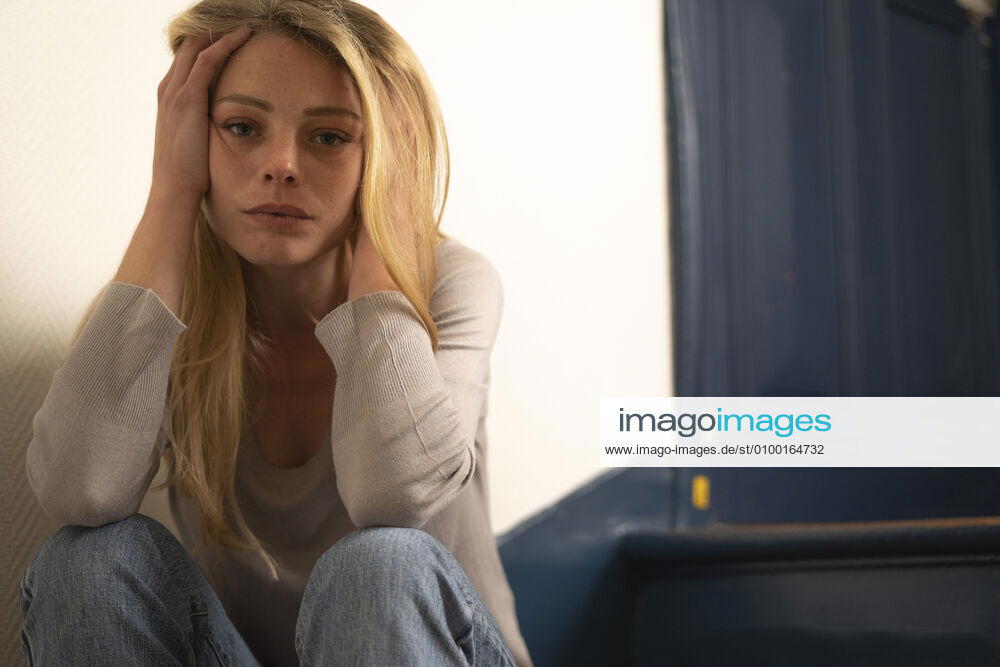 Young woman sitting on steps