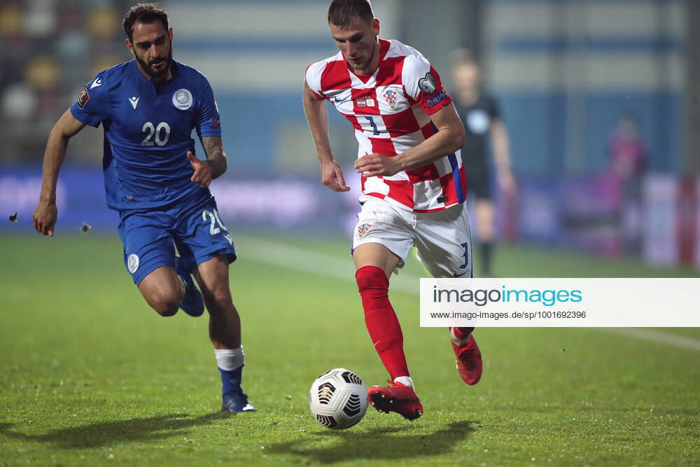 Croatia v Cyprus - FIFA World Cup, WM, Weltmeisterschaft, Fussball 2022 Qatar Qualifier RIJEKA, CROATIA - MARCH 27: Grigoris Kastanos of Cyprus and Borna Barisic of Croatia during the FIFA World Cup 2022 Qatar qualifying match between Croatia and Cyprus on March 27, 2021 at HNK Rijeka stadium in Rijeka, Croatia. IgorxKralj PIXSELL