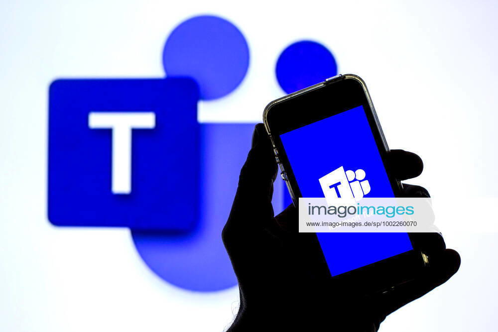In this photo illustration a Microsoft Teams app seen displayed on a smartphone with the Microsoft Teams logo in the background. Barcelona Spain - ZUMAd159 20210420_zia_d159_107